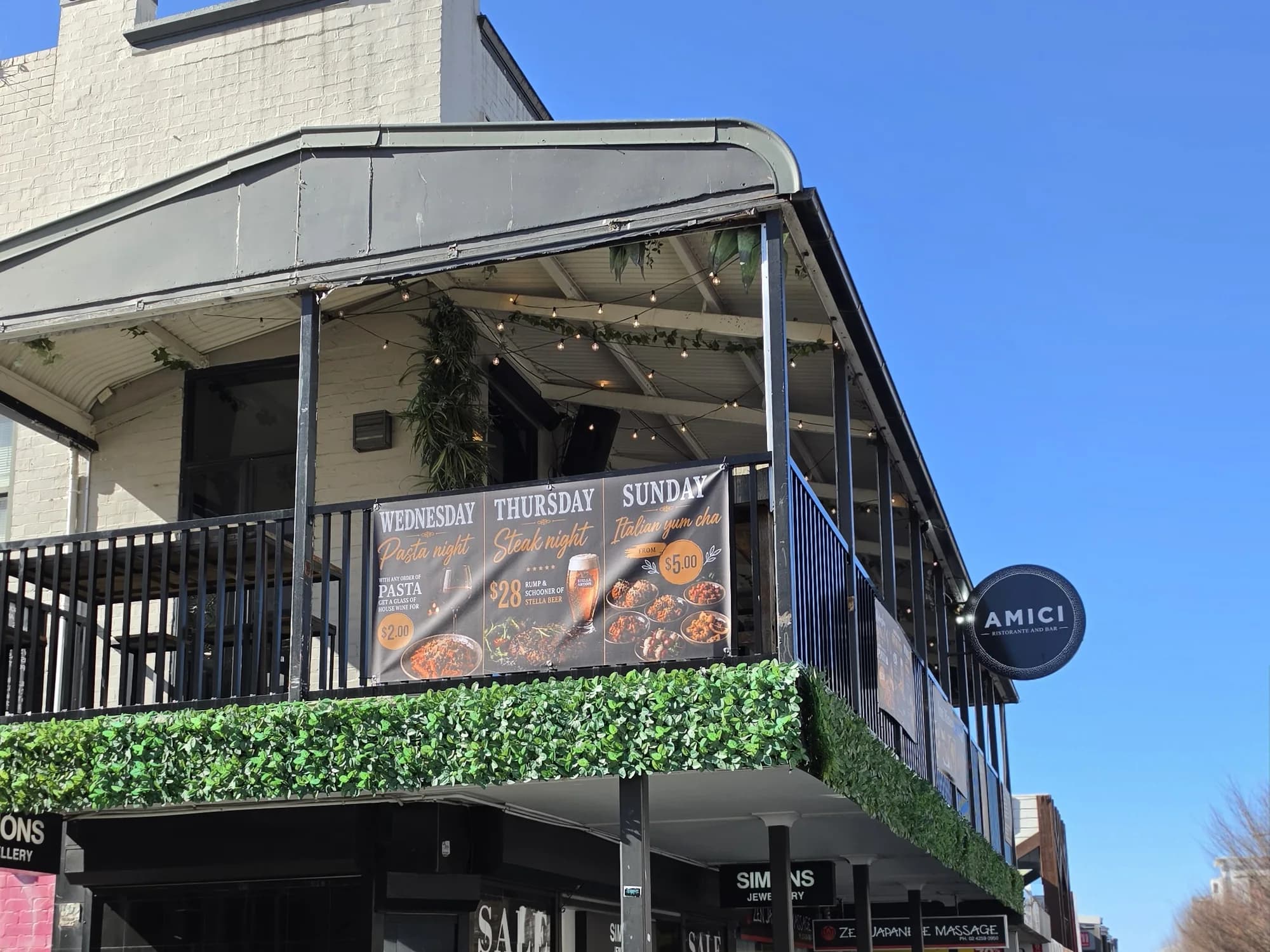 The corner frontage of Amici Ristorante and Bar on Crown Street, with its upstairs dining balcony