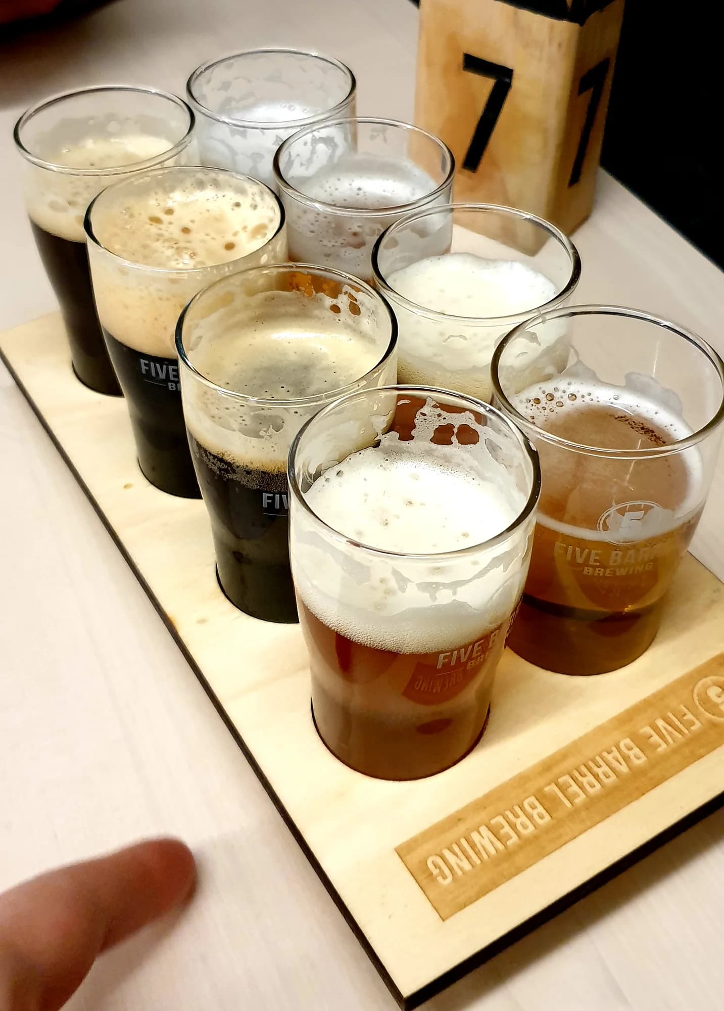 A tasting paddle of Five Barrel Brewing beers, from dark stout to pale ale