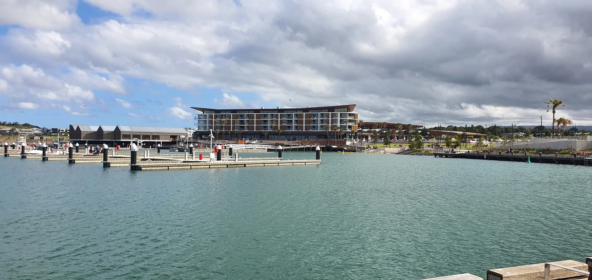 The marina at Shell Cove, with the waterfront hotel across the water