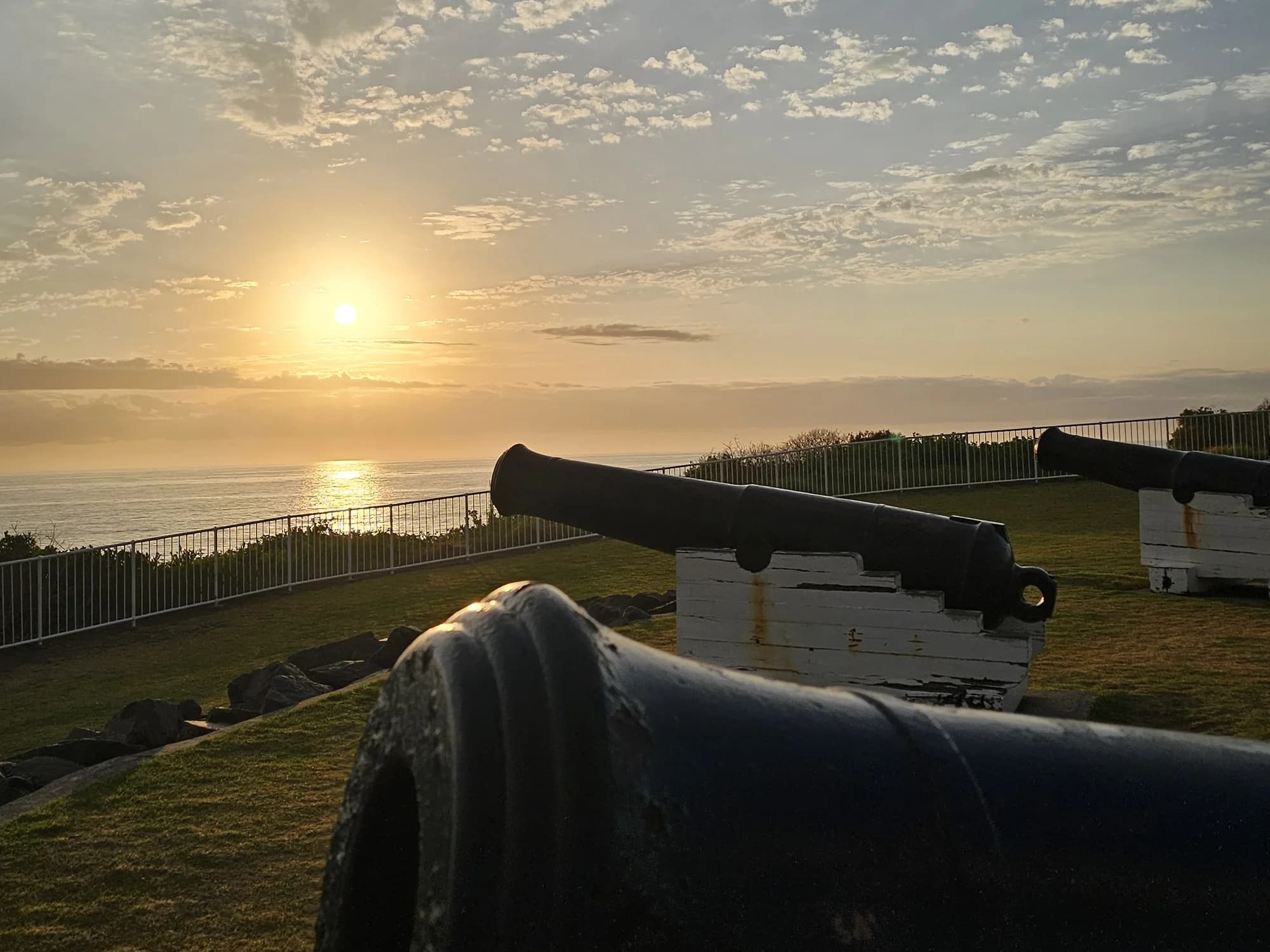 The historic cannons of Flagstaff Hill silhouetted against the sunrise