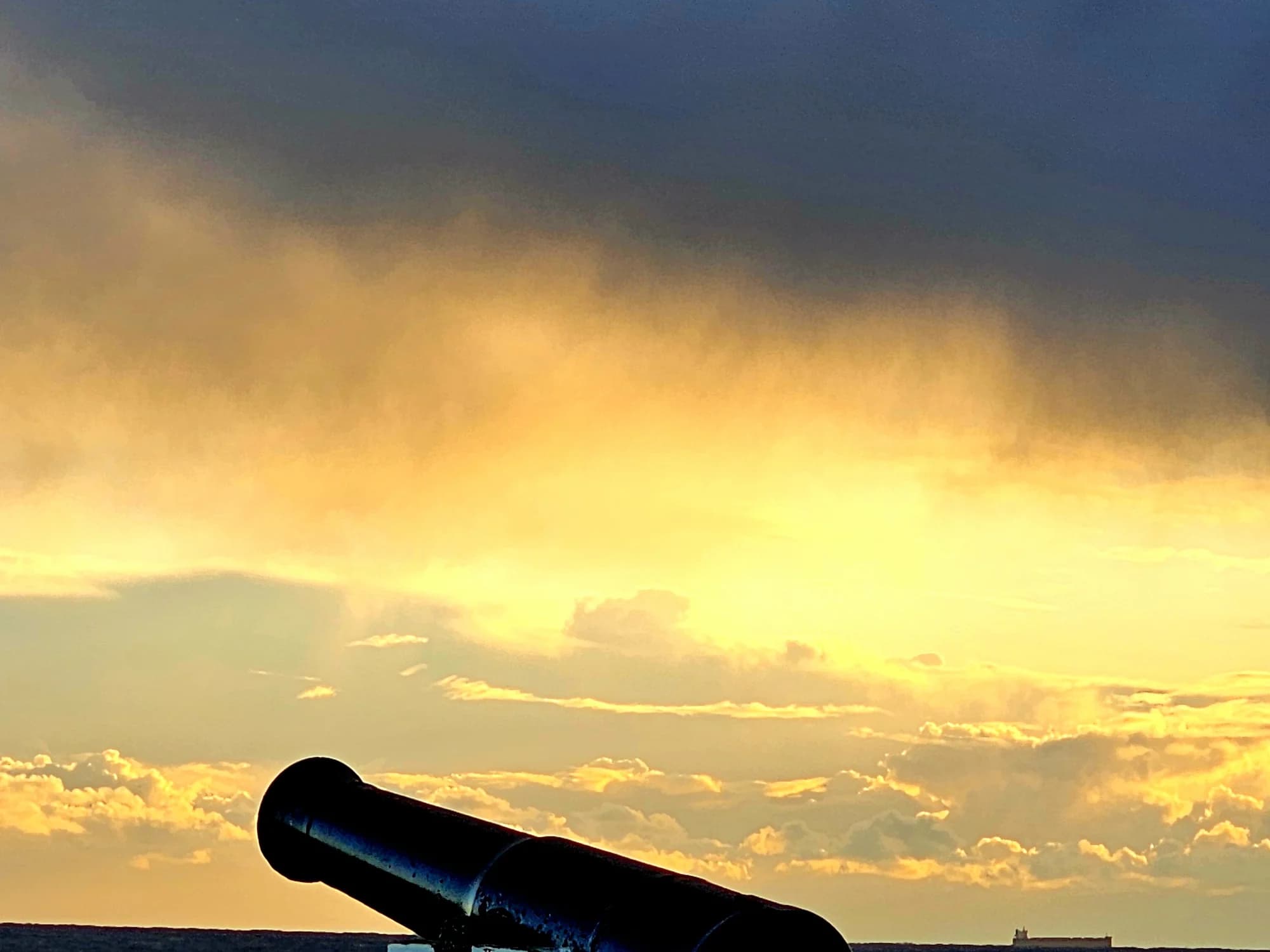 A cannon on Flagstaff Hill facing a stormy grey sea