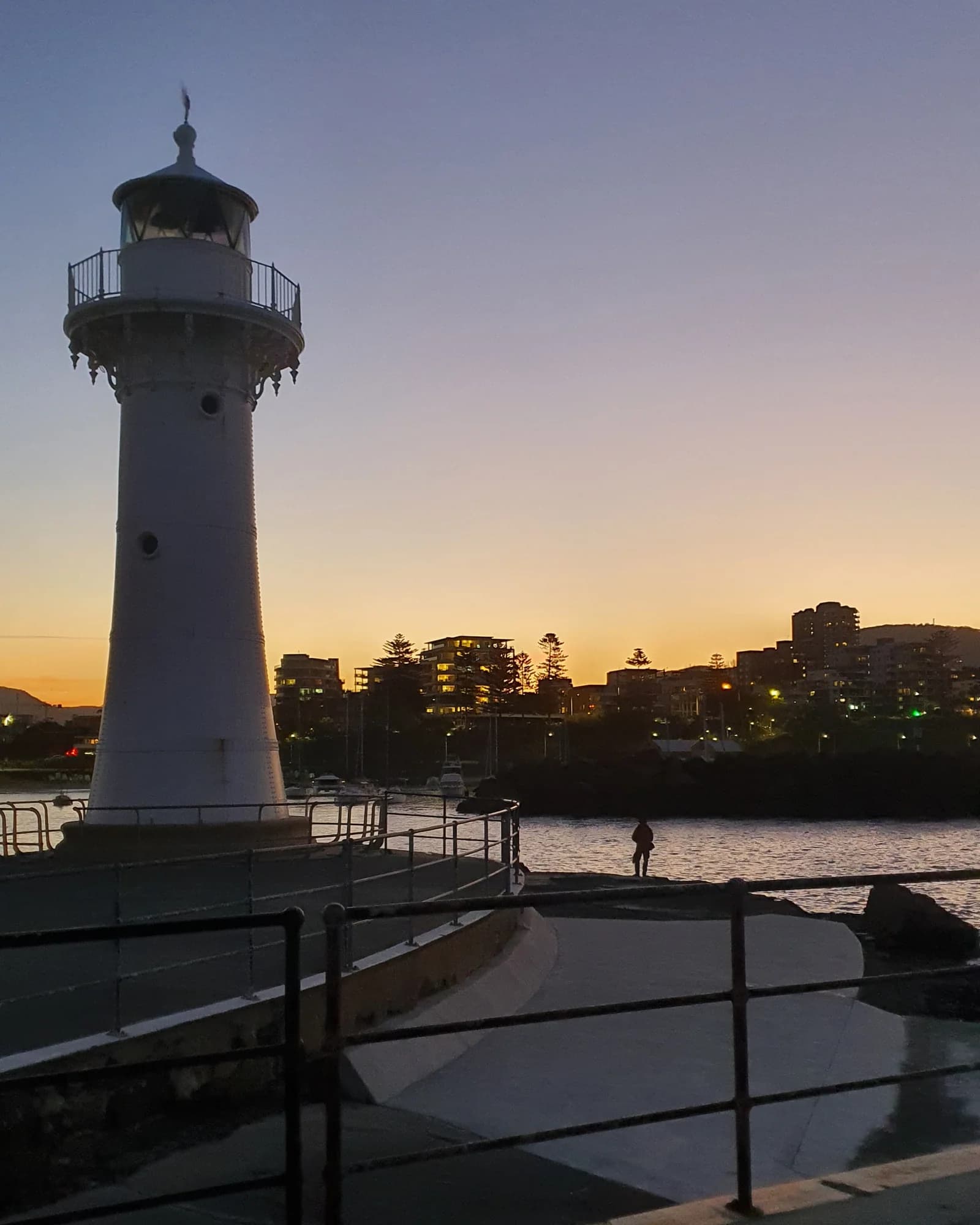 The Breakwater Lighthouse and harbour wall in the last light of the evening